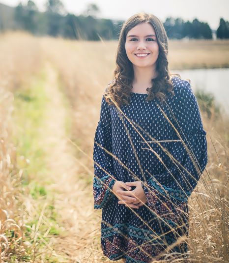 Professional image of Lauren Pike standing in a field